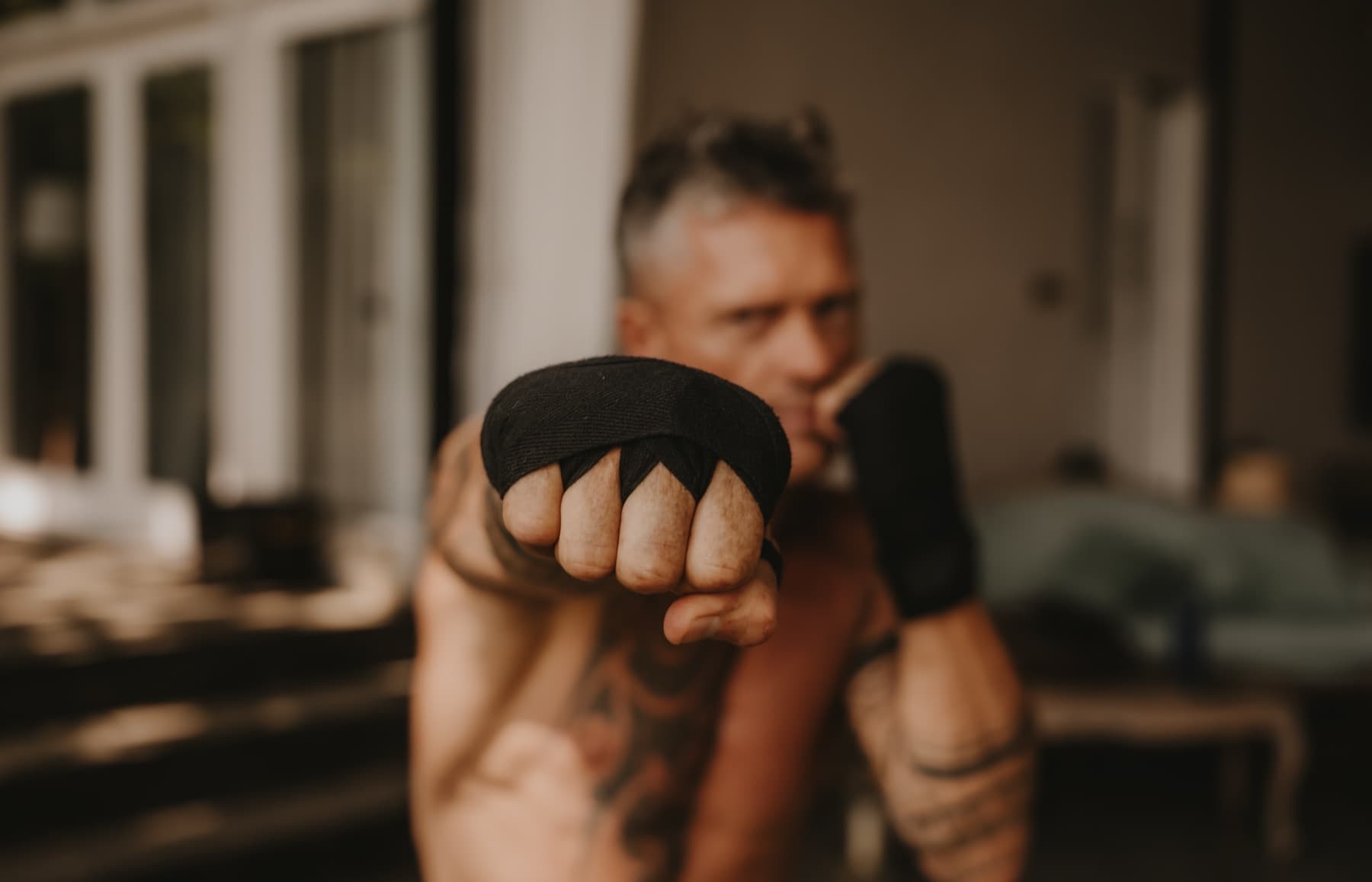 A wrapped fist held out toward the camera in the Contact Room